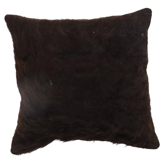 Pillow made from a vintage mohair rug in black. zipper closure and poly foam insert provided. Measures: 16'' x 16''.