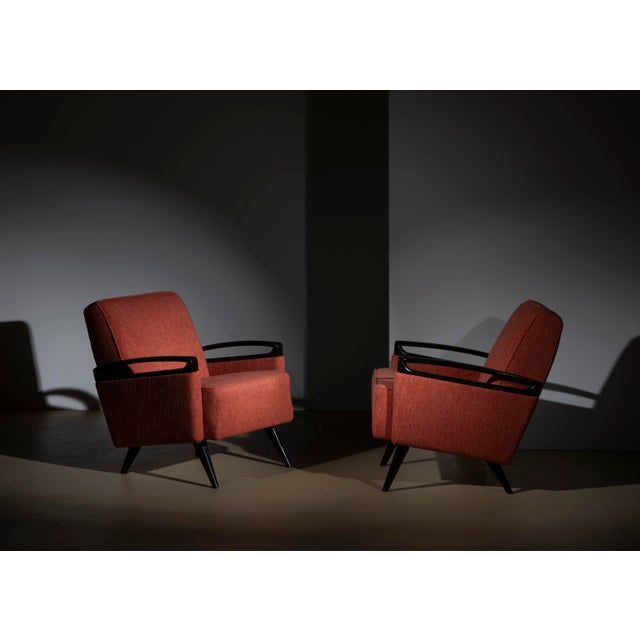 An elegant pair of vintage Italian armchairs dating back to the 1950s, an authentic expression of Midcentury Modern...
