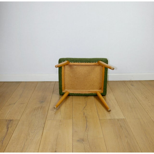 Large boucle stool seat in green-olive colour with round beech legs. A vintage stool manufactured in the 1970s. Fully...