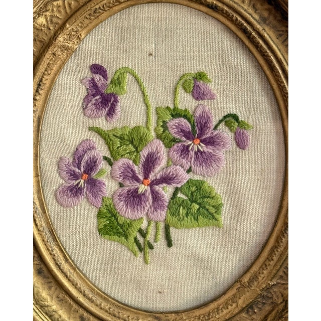 Pretty handmade purple and green floral needlepoint in an oval gold toned frame Please see condition details noted. Most...
