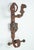Antique Gothic grand double door wrought iron door pulls with central steel shields and knockers. The left shield displays...