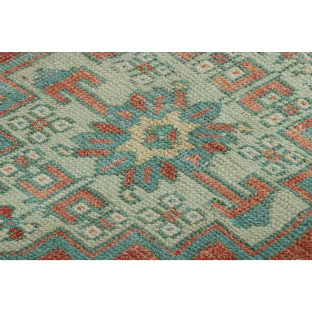 Made with hand-knotted wool, this 2x3 gift-sized vintage Turkish rug originating circa 1950-1960, is from the collection...