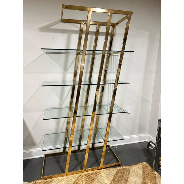 Vintage 1970's brass etagere shelf unit styled after the Design Institute of America (DIA). The unit features an angular...