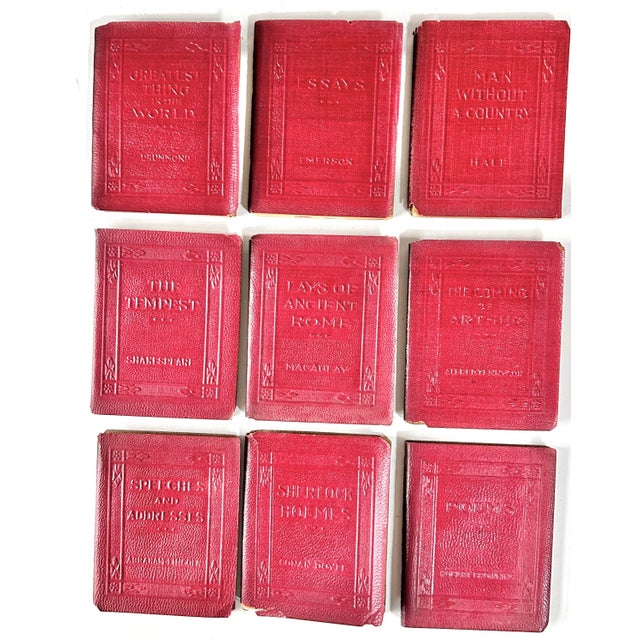 A charming 1920s miniature red leather book set from the “Little Luxart Library,” comprising 15 volumes with gilt-stamped...