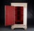 This Swedish corner cabinet, produced in the early 1800s, contains a series of gold-colored decorative features typical of...