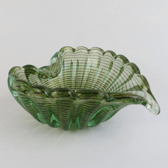 1950s Ercole Barovier decorative blown glass leaf-shape bowl using zebrati technique. The translucent green glass is...
