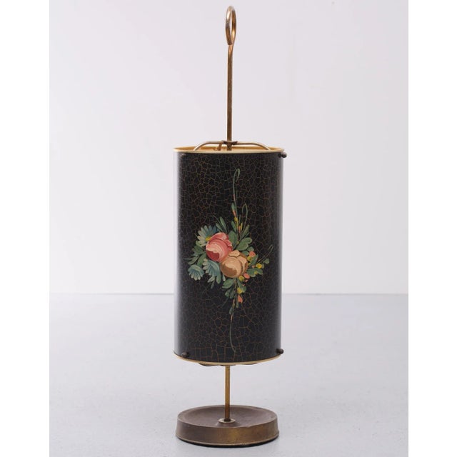 Very nice umbrella stand. Metal with heavy Brass base. Decorative hand painted flowers. Comes with the original name tag....