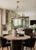 Designer Chapman & Myers Launceton Ring Chandelier in Antiqued Burnished Brass Finish. Specifications: Height: 28.25"...