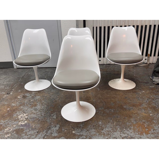 Design Plus Gallery presents a Set of Four Tulip Armless Chairs Model 151C by Eero Saarinen from Knoll Studio. Originally...