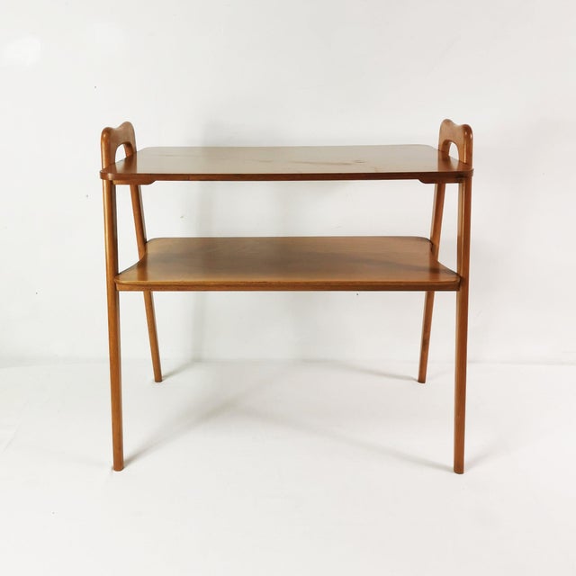 Side table of German origin, dating to the 1960s. It features a spatial, minimalist form characteristic of the Modernist...