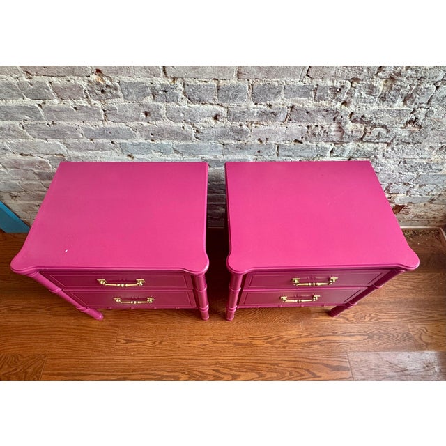 Add a pop of color and retro charm to your bedroom with this pair of vintage faux bamboo pink nightstands. Two drawers...