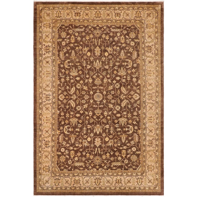 Designed with a mesmerizing intricate geometric motif this glorious hand knotted rug is a masterpiece that will fill any...