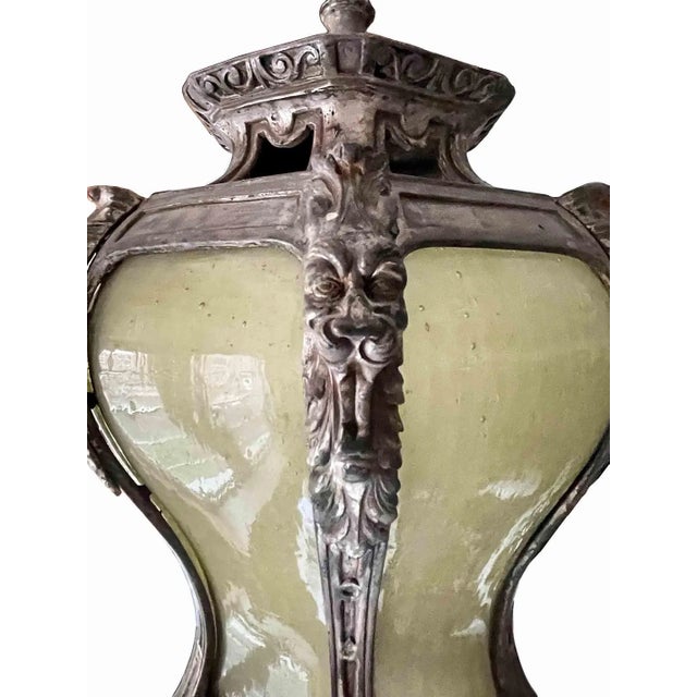 Rare and stunning antique 1920's ceiling light. This elegant pendant lantern has a highly ornamented bronze frame...