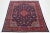 This Vintage Mahal wool rug has a blue field with red, peach, and beige accents throughout the design. This rug measures...