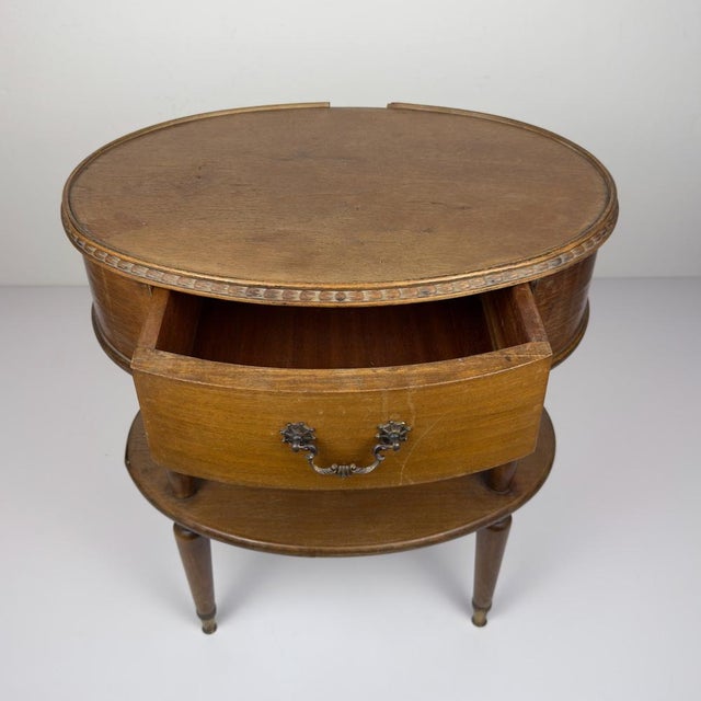 Beautiful bedside table was made in the 1950s in Italy. Made of solid wood, plywood. Original fittings. Good vintage...