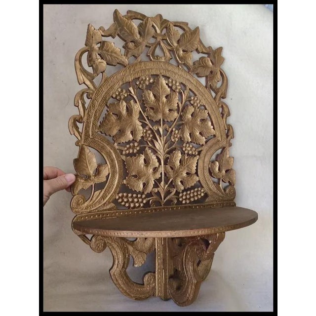 An Antique Victorian Shelf. The shelf is hand carved from wood and has nice attention to detail and a lovely old gold...