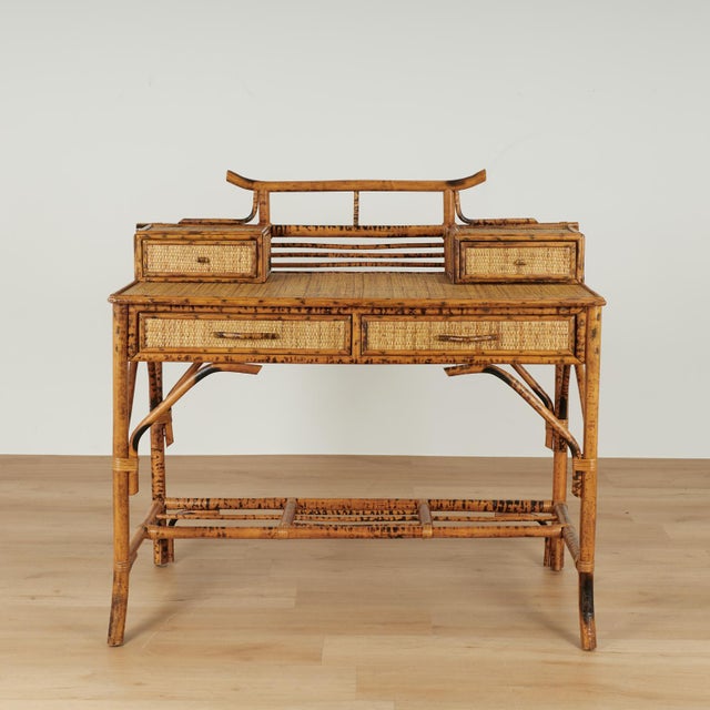 Standout vintage British Colonial Style desk crafted in faux burnt bamboo and grasscloth featuring a pagoda style top over...