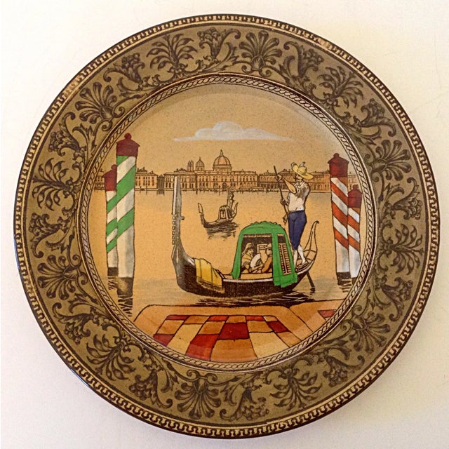 Lovely plate by the Royal Doulton factory in England of a couple in a gondola with the town of Venice in the background....