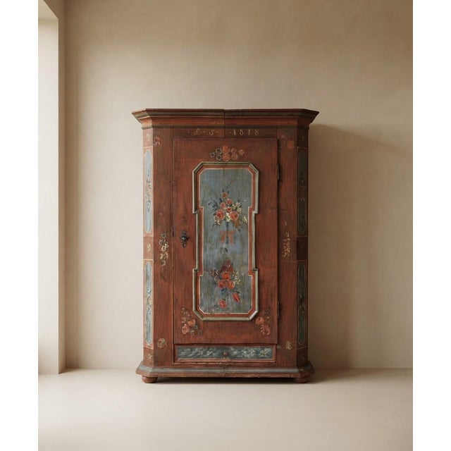 Exquisite single-door antique painted wardrobe, dated 1818. This authentic Tyrolean piece showcases original polychrome...