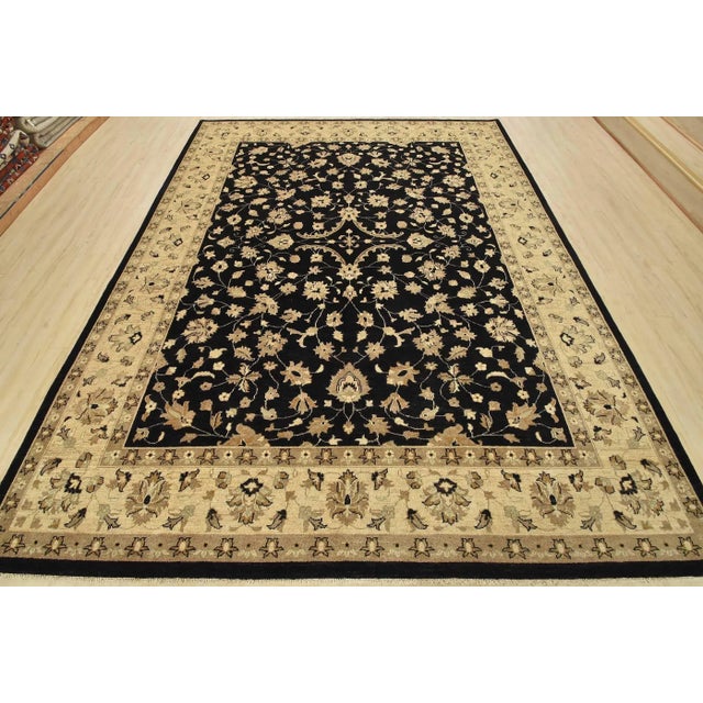 A traditional Ziegler rug hand-knotted with an all-wool pile on a cotton foundation. This oriental rug features an all-...