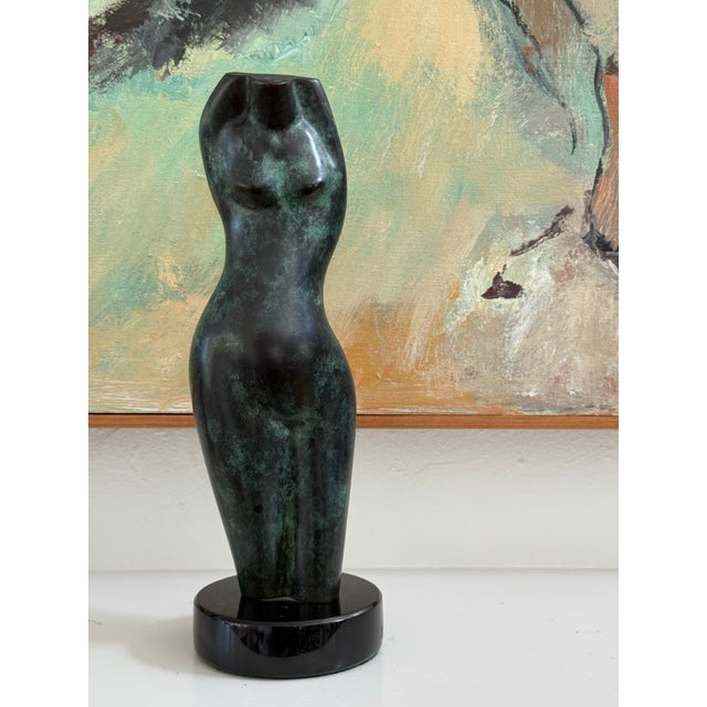 Nice modernist sculpture of a female torso. Mottled green patina. Signed “Davenport ‘95.” On a black stone base. Just...