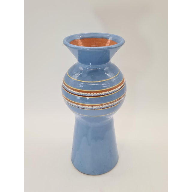 An original vintage ceramic vase with a decorative, distinctive shape, dating from the mid-20th century. The vase has an...