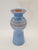 An original vintage ceramic vase with a decorative, distinctive shape, dating from the mid-20th century. The vase has an...