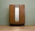 A mid century three door Tola and Black wardrobe from G Plan (EGomme) Featuring a bi fold door and a rail the full width...