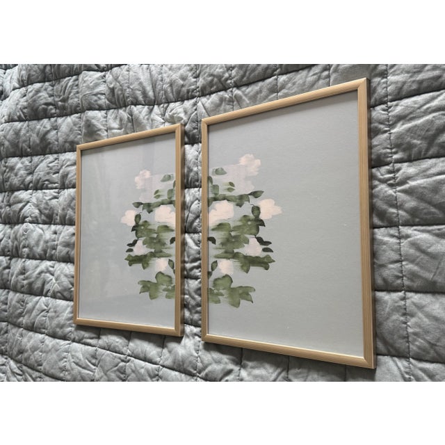 Pair limited sold out edition unsigned fine art artist-made giclees on paper, framed in painted champagne solid wood. An...