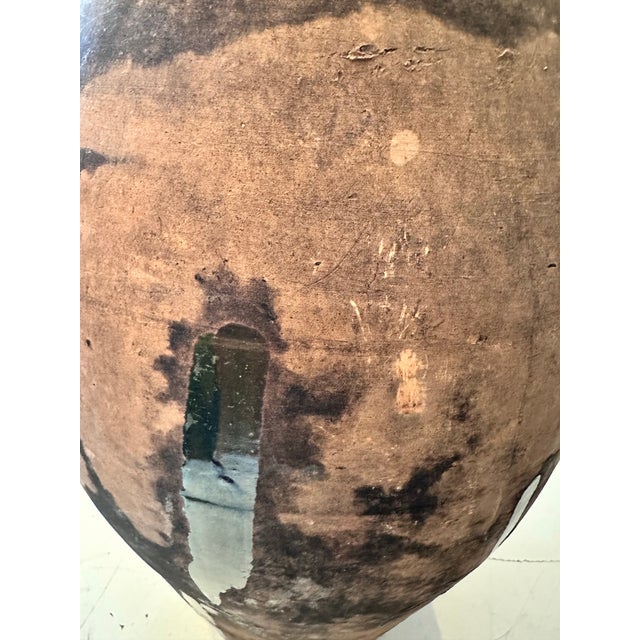 A French vintage earthenware vessel, beautifully aged with a natural patina that speaks to decades of use and...