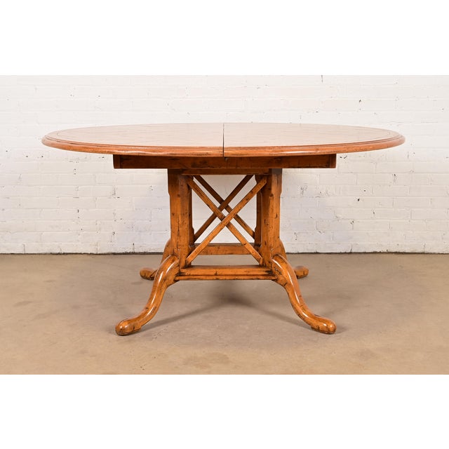 An exceptional English Country or Rustic European style pedestal extension dining table By Guy Chaddock & Co. USA, Late...