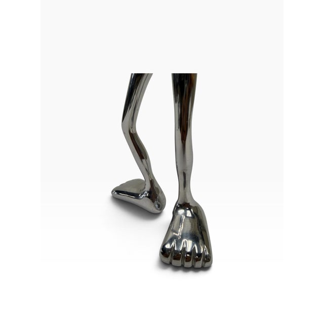 Add a touch of playful, sculptural luxury to your workspace or reception desk with this authentic cast metal business card...