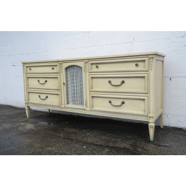 This classic Dresser is made out of wood, metal, and fabric. This Dresser is made in the lovely French Shabby Chic style...