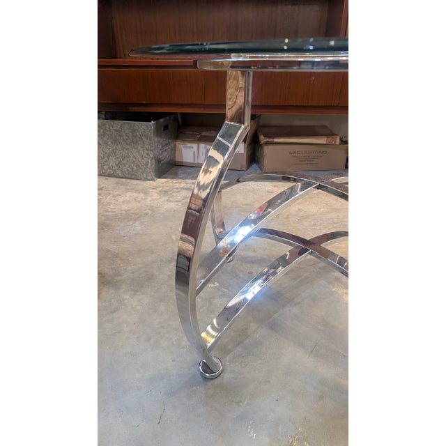 Elevate your living space with this stunning vintage Mid-Century Modern accent table. Featuring a high-polish chrome-...