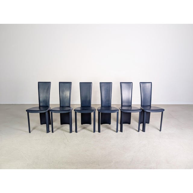 Six beautiful dark blue dining chairs from the renowned Italian manufacturer Frag. These chairs were handcrafted in Italy...