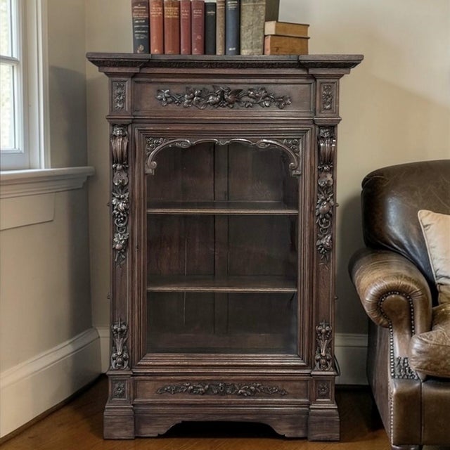 A charming example of antique furniture, this 19th century Renaissance Revival vitrine ~ bookcase captures the quiet...