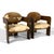 This pair of rare Italian lounge chairs are simply sublime. The dark wood external frames support the seat and back...