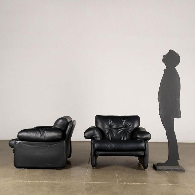 Iconic pair of armchairs, designed by Mr and Mrs Scarpa in the 1970s with foam padding and black leather upholstery. This...