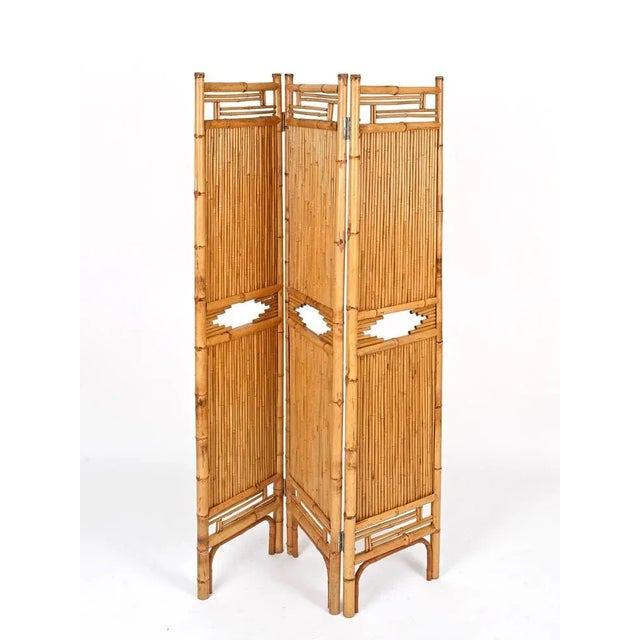 Stunning Mid-Century French Riviera style folding screen entirely made of bamboo and rattan canes. This stylish piece was...