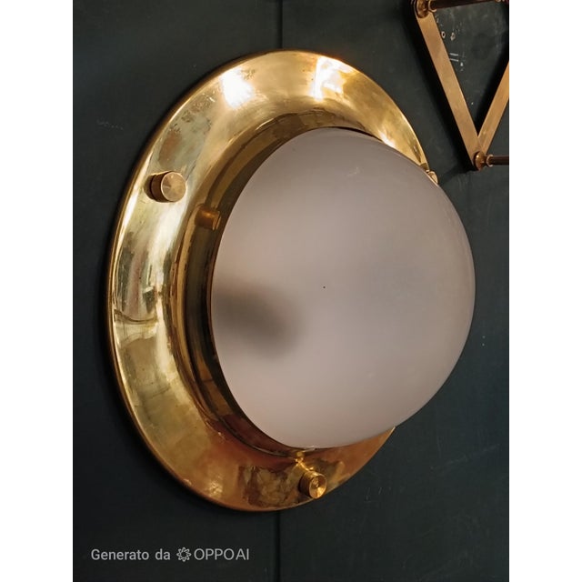 Mod. LSP6 Tommy brass wall/ceiling lamp by the renowned Luigi Caccia Dominioni, created exclusively for the acclaimed...