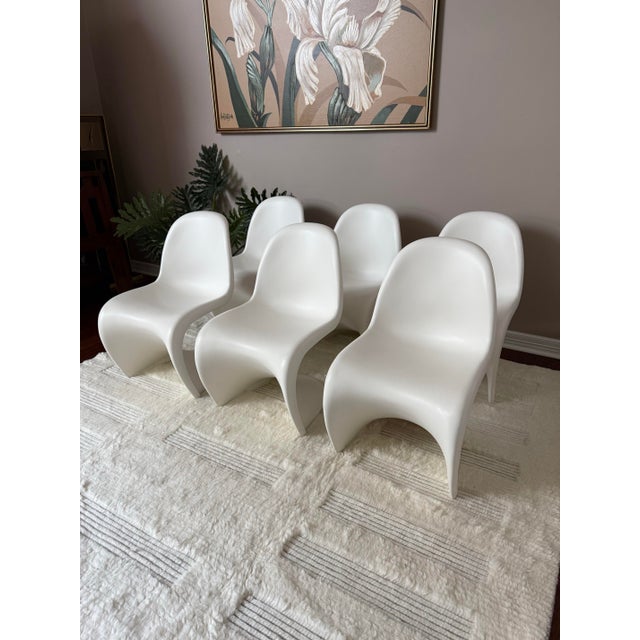 Gorgeous sculptural molded chairs by Verner Panton for Vitra, with attributions to Herman Miller. This is a set of 6...