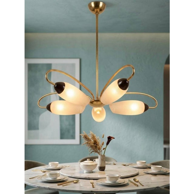 Designed in France in the early 1950s, this chandelier captures a moment when lighting was conceived as both utility and...