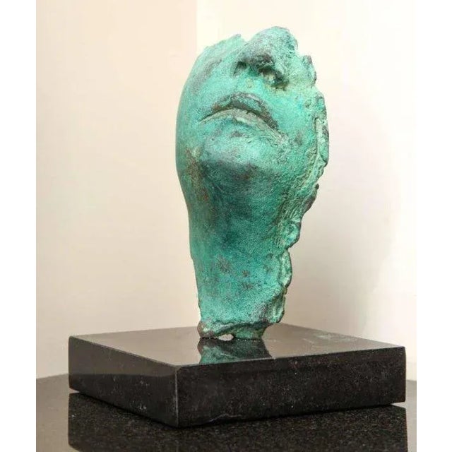 The cast bronze with green patina on granite base is a unique sculpture by the artist. This one-of-a-kind piece....