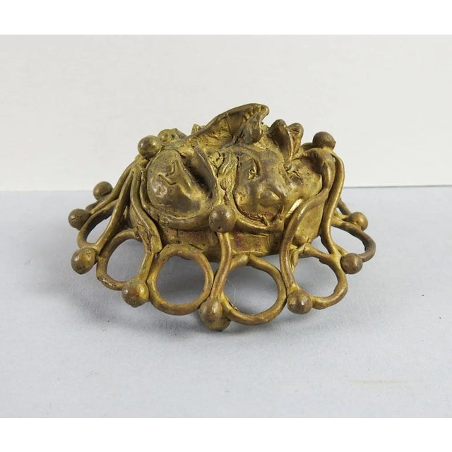 Circa 1970's bold sculptural hand made lost wax method cast brass jester face belt buckle. Signed Kelly K on the back....