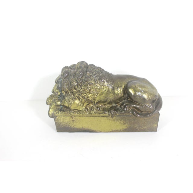 Width: 8 inches Height: 4.5 inches Depth: 2.5 inches Sculpture or bookend of Antonio Canova’s sleeping lion. This is cast...