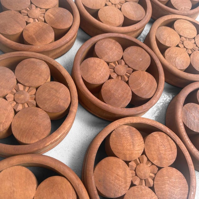 Elegant set of 9 Japanese wooden ornaments, each featuring the stylized Umebachi-mon (梅鉢紋) – a kamon (family crest) in the...