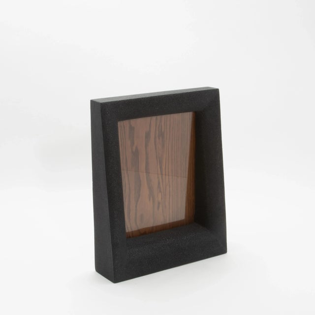 This 8x10” picture frame by R&Y Augousti epitomizes timeless elegance with its luxurious use of black shagreen, lending a...