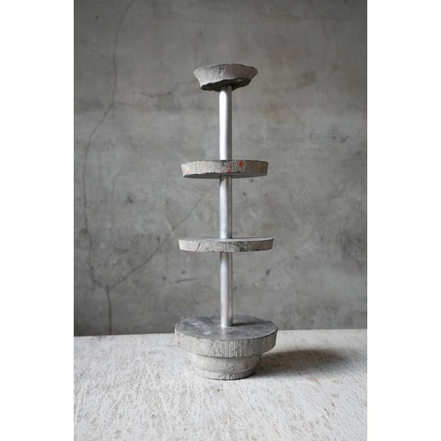 Remnant Etagere Sculpture by Studio DO Dimensions: Ø 18 x H 53 cm Materials: Aluminium Color: Shades of grey 6,5 kg