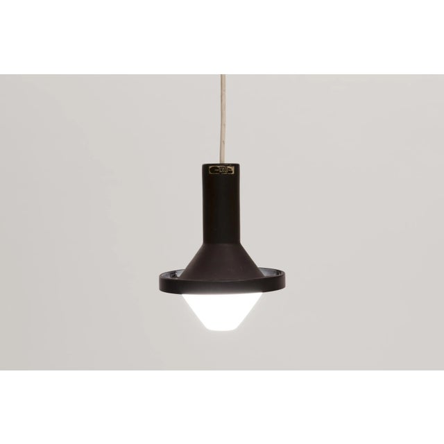 This pendant light was designed by tapio wirkkala and produced by idman in finland during 1970s. It is fitted with an...