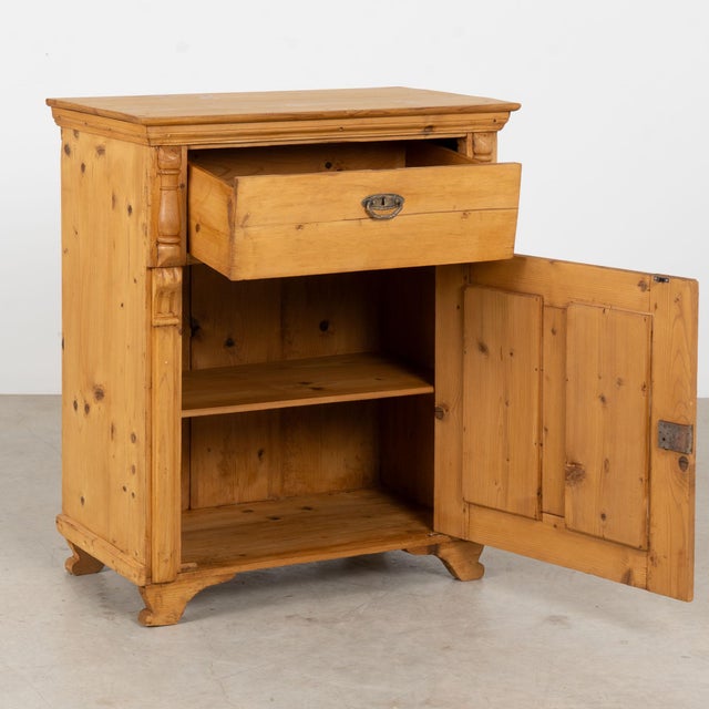 19th century Hungarian sideboard, crafted in pine with a simple country form. One large upper drawer sits above a single...
